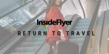 a woman standing on an escalator