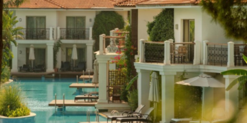 a pool with chairs and a deck chair