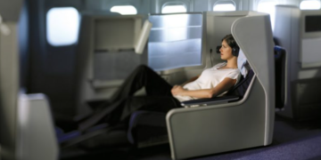 a woman sitting in an airplane