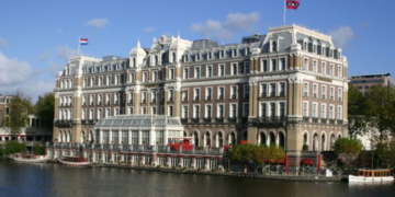 a building next to a river