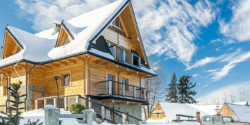 a house with snow on the roof