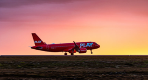 a red airplane on a runway