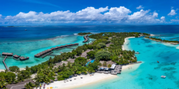 an island with a beach and a dock