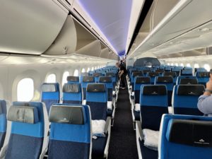 an airplane with blue seats and windows