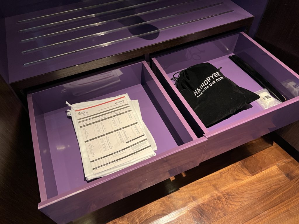 a purple drawer with papers inside