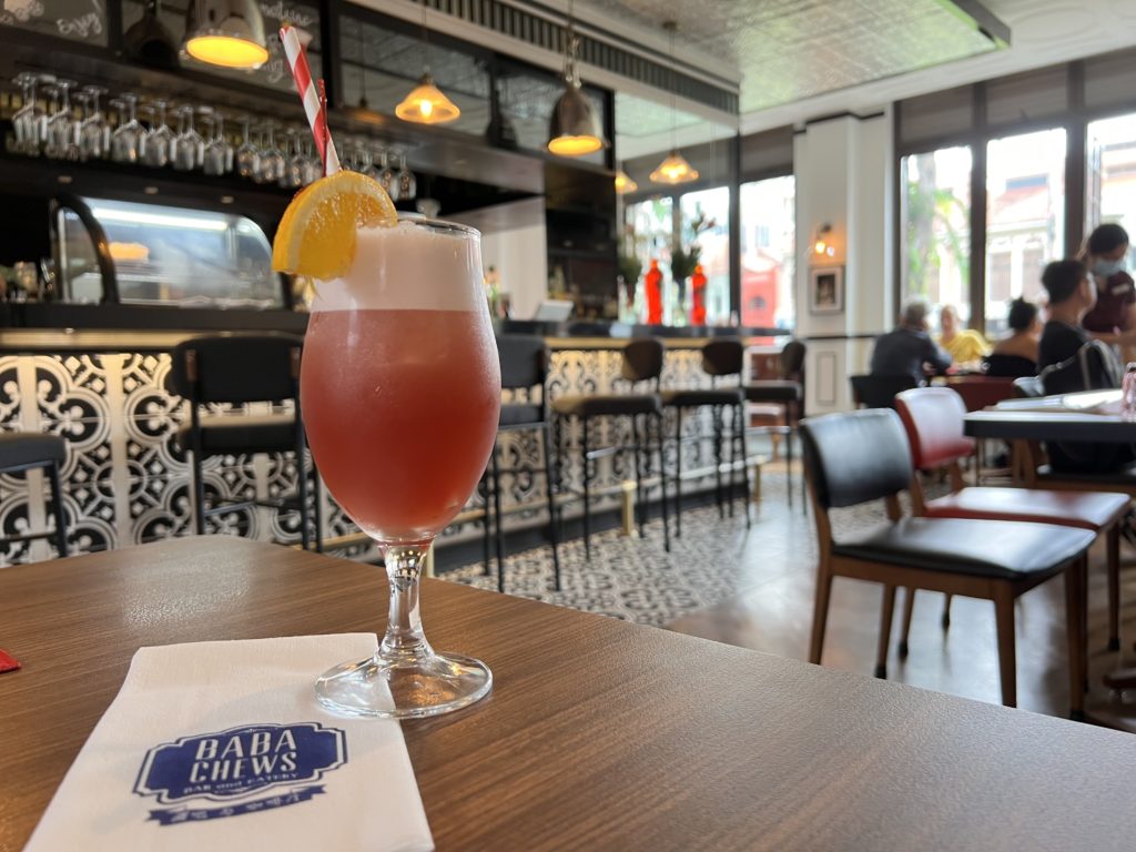 a glass of drink on a table