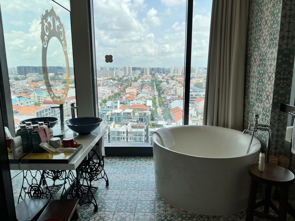 a bathroom with a large tub and a large window