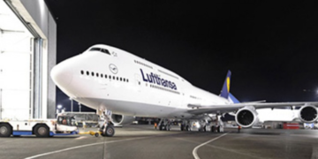 a large white airplane at night