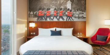 a bed with a picture of a marching band