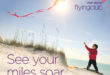 a child flying a kite on a beach