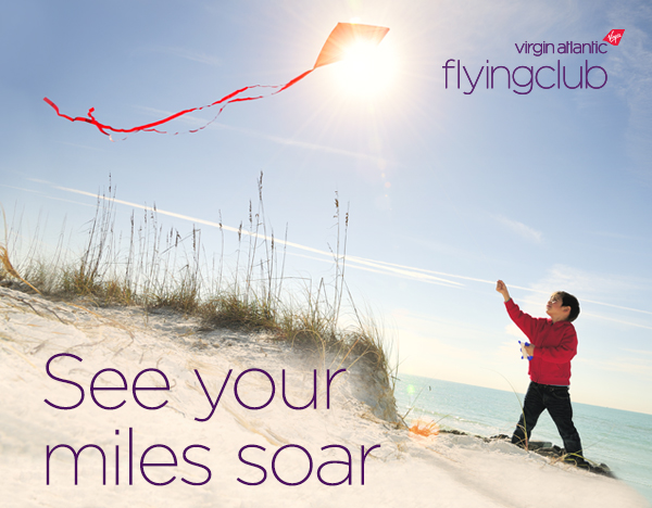 a child flying a kite on a beach