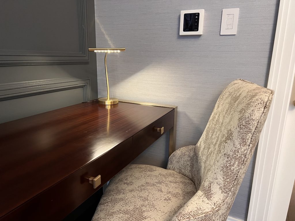 a desk with a lamp on it