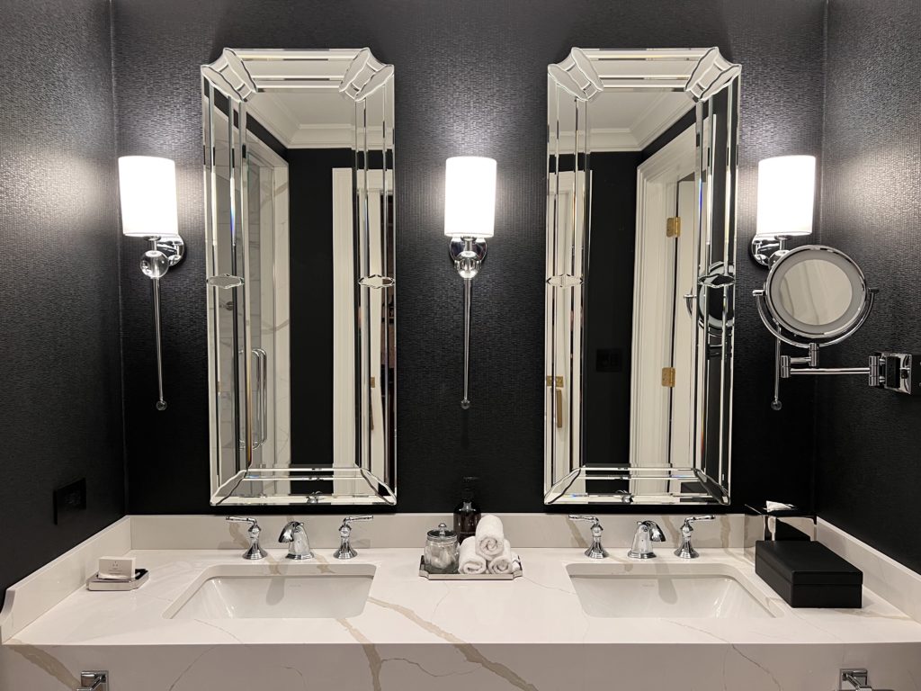 a bathroom with mirrors and sinks