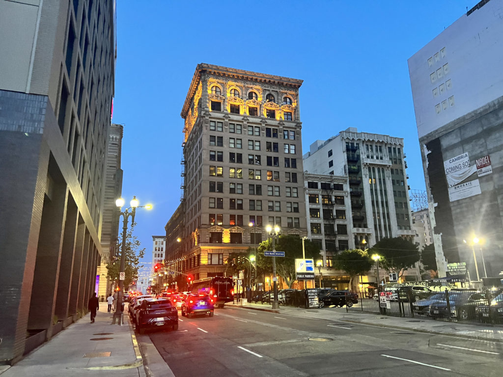 a city street with cars and buildings