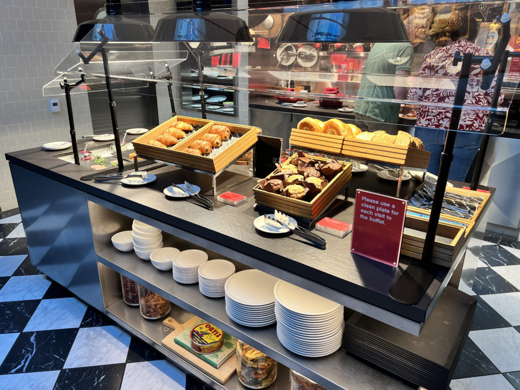 a buffet table with food items on it