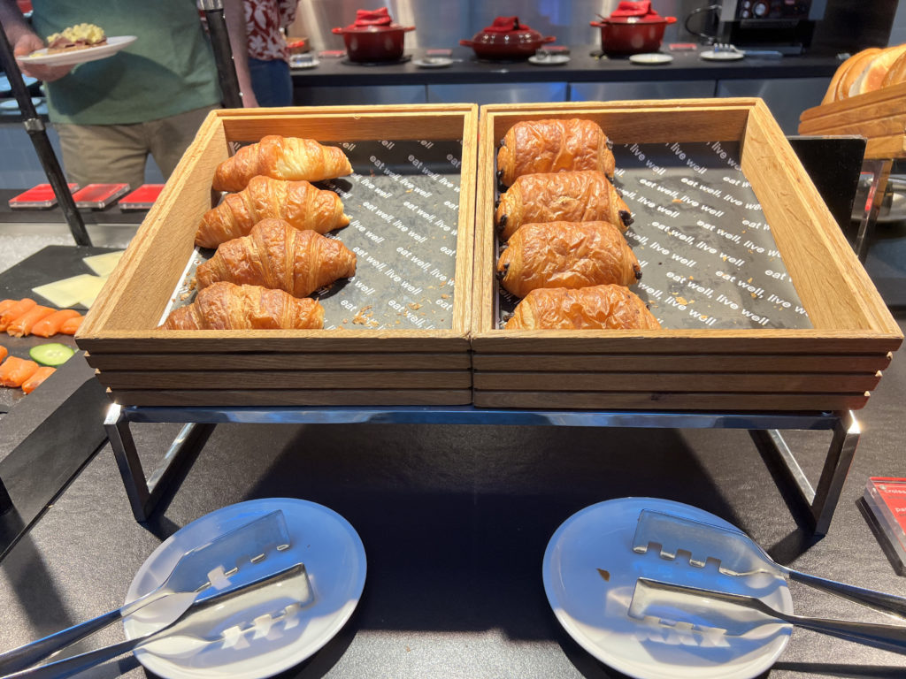 a tray of croissants on a table