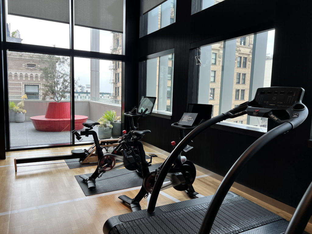 a room with exercise bikes and a window