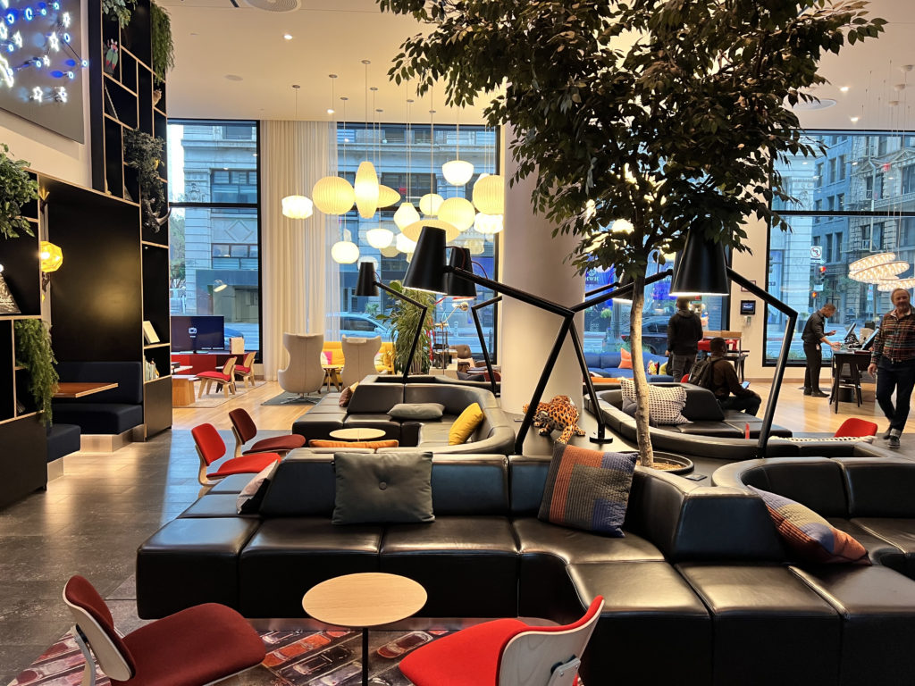 a large room with a large tree and a large couch