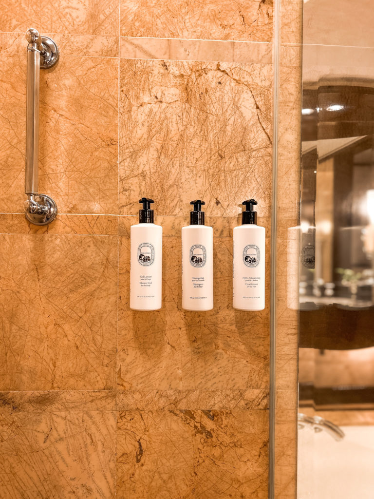 a group of white bottles on a wall