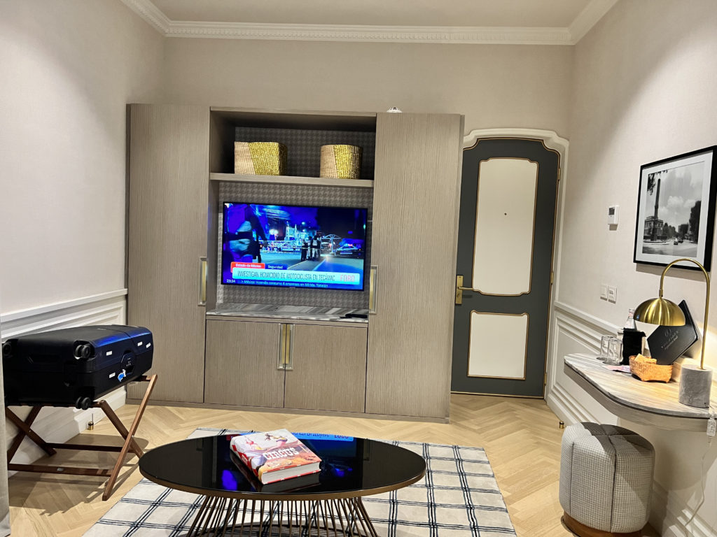 a room with a television and a table