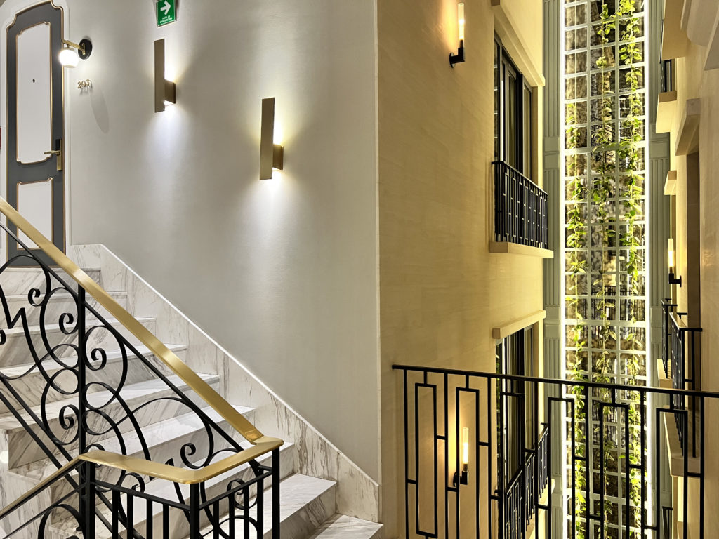 a staircase with a railing and lights