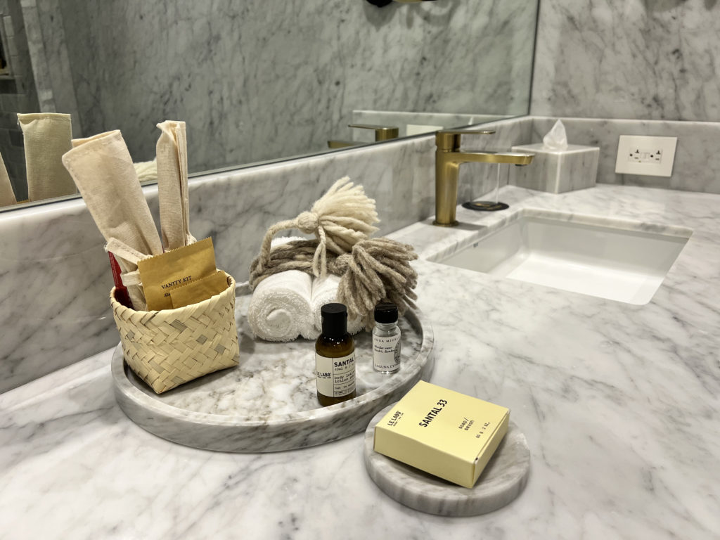 a bathroom counter with a sink and a mirror