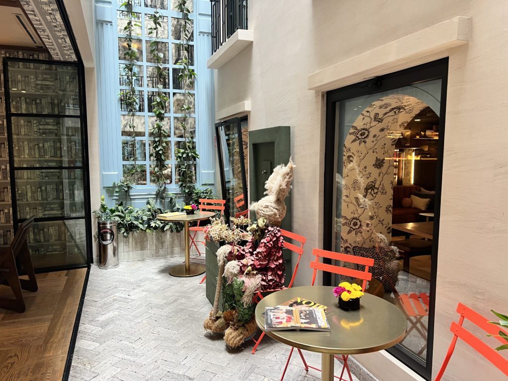 a patio with chairs and tables