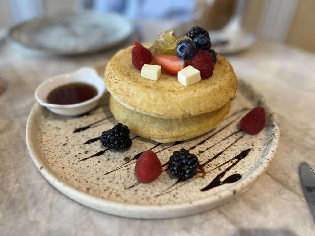 a plate of food with fruit on top