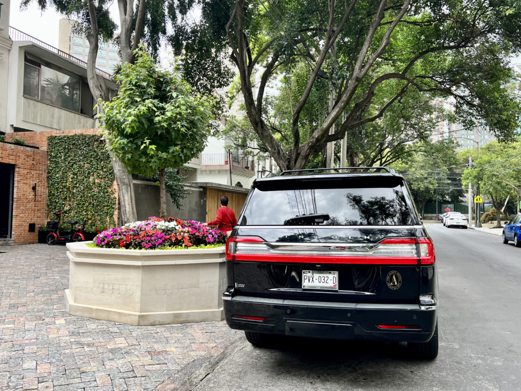 a black car parked on the side of a road