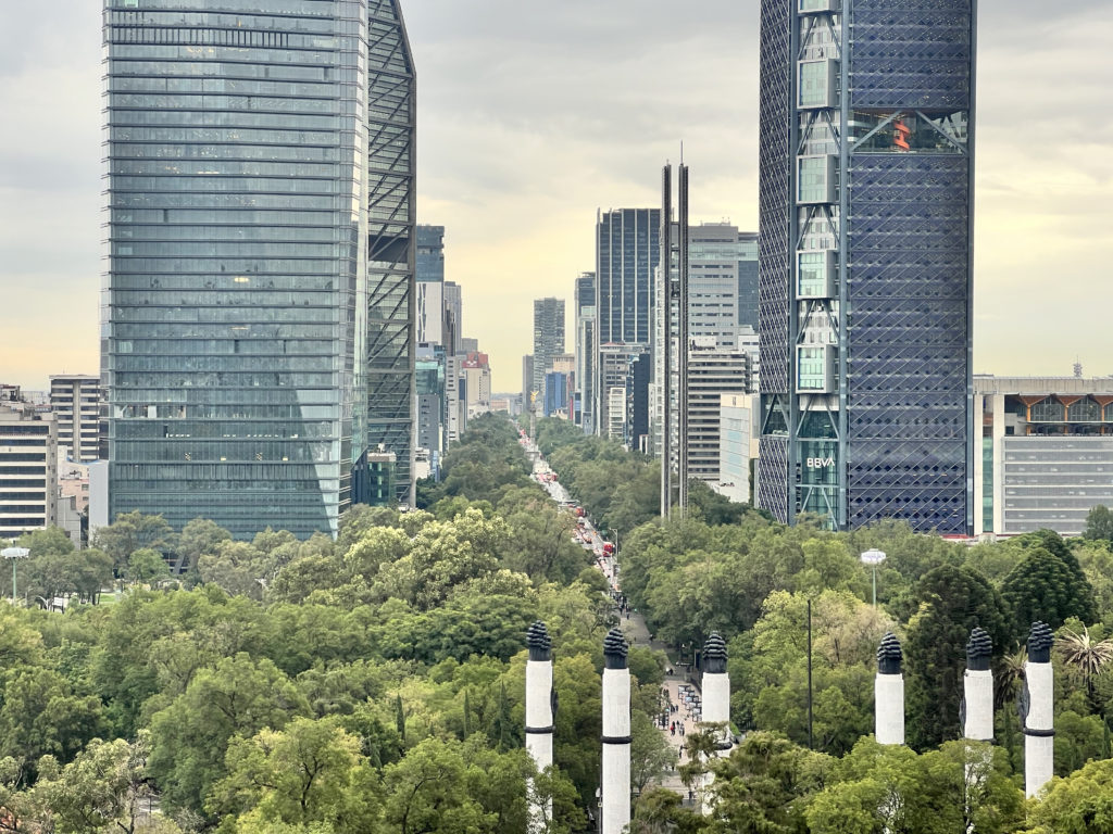 a city with tall buildings and trees