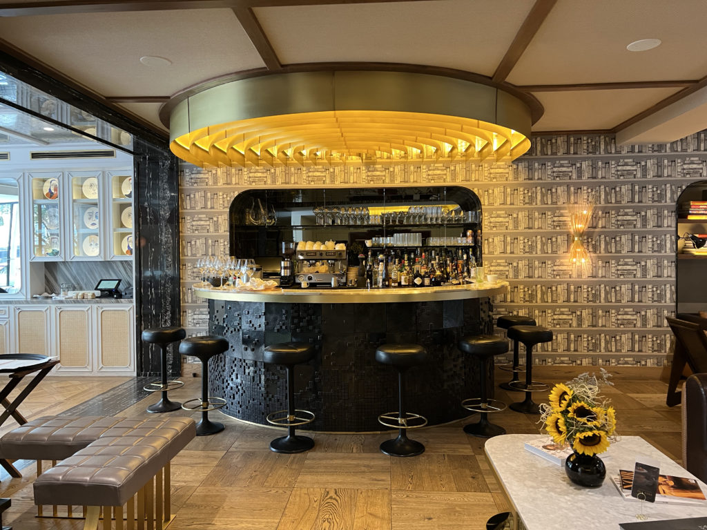 a bar with a round counter and stools