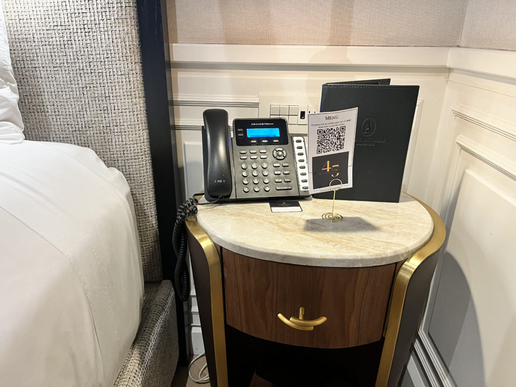 a telephone and a book on a table