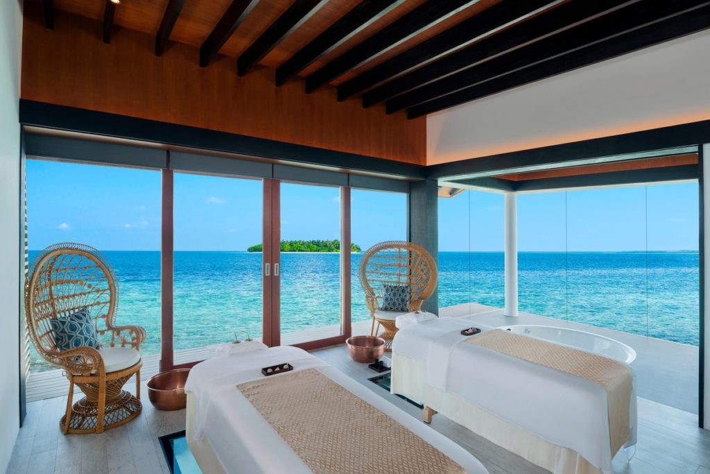 a room with a large window overlooking the ocean